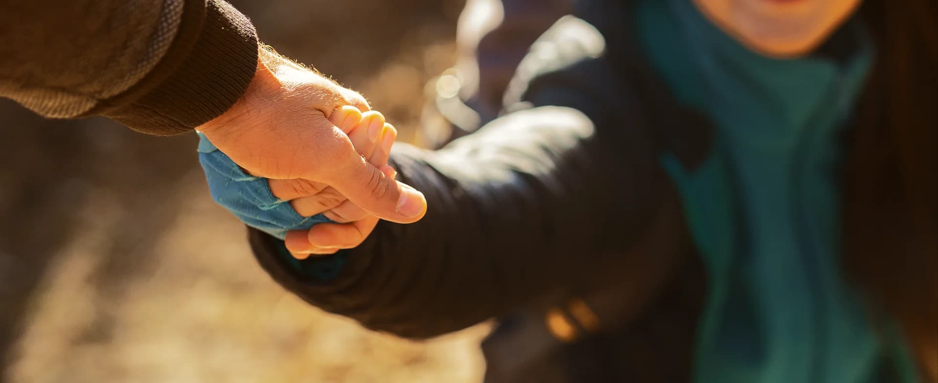 Two people holding hands
