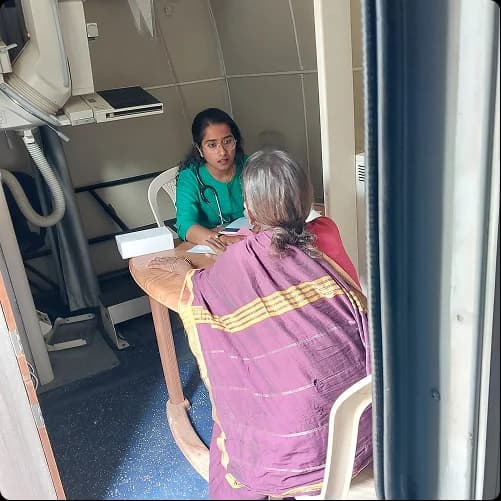 Health worker conducting a screening